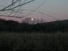 Full moon setting at dawn over Patagonia Lake, AZ