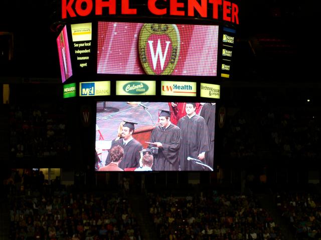 Jeff Picking Up His Diploma at Kohl Center